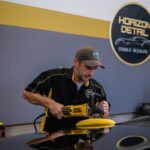 Owner of Horizon Detail pictured performing paint correction in preparation for ceramic coating application